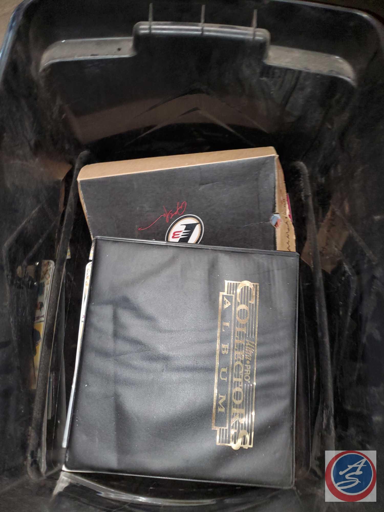 Large black tote full of baseball and other sports cards