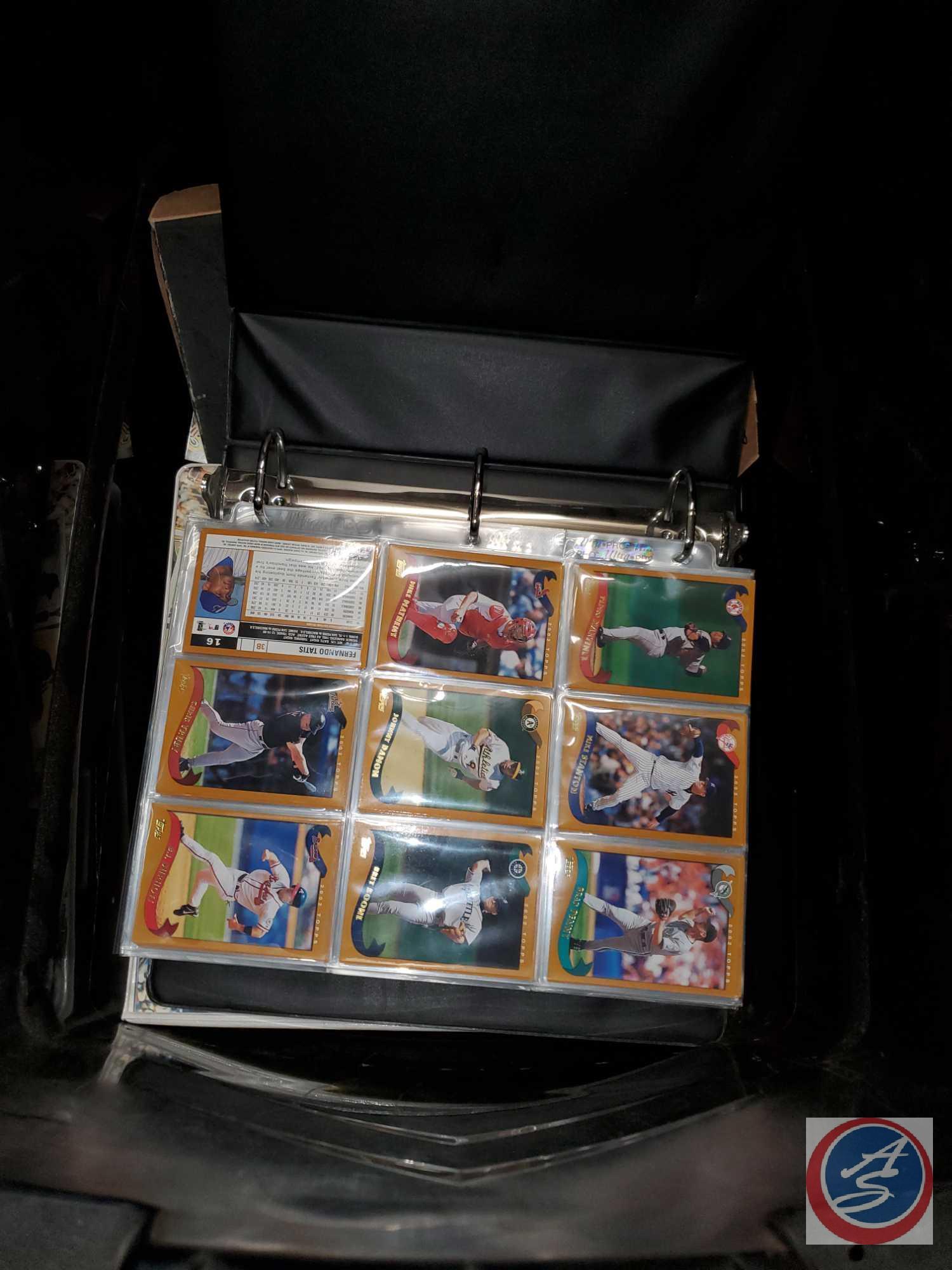 Large black tote full of baseball and other sports cards