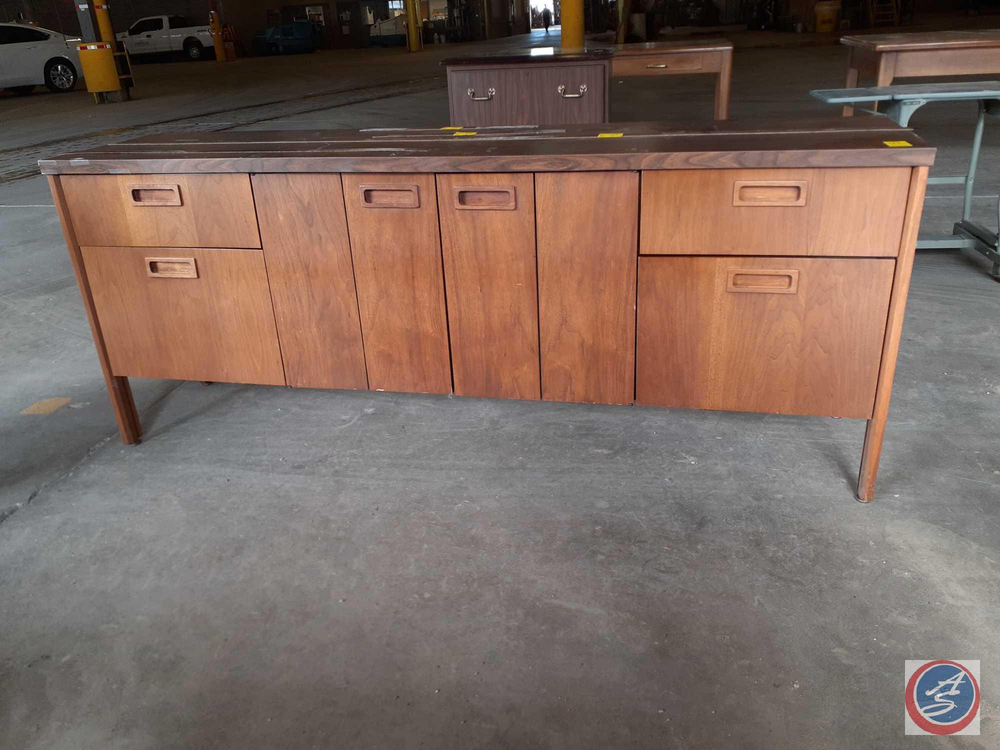 Antique / vintage wood credenza with two doors on the left, two doors on the right, and two bifold