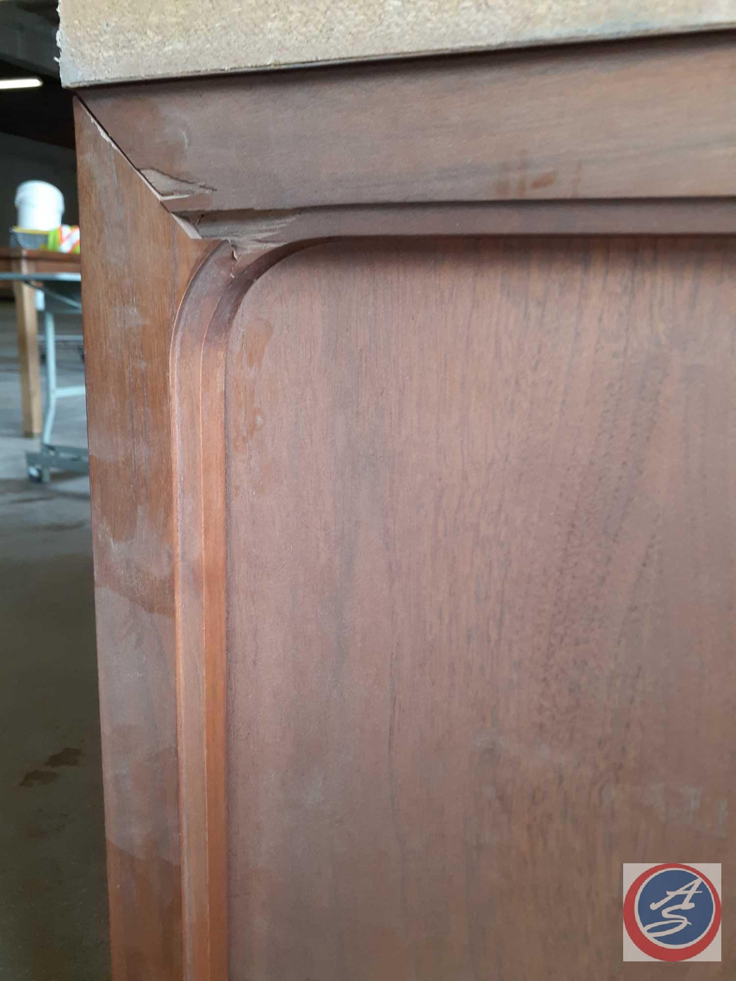 Antique / vintage wood credenza with two doors on the left, two doors on the right, and two bifold