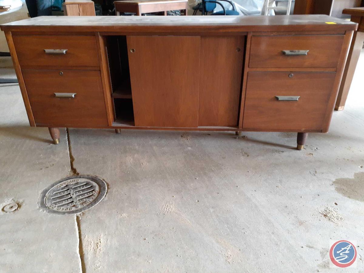 Antique / vintage wood credenza with two drawers on the left, two drawers on the right, and two