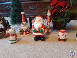 Assorted Holiday Decorations Including Santa's Sleigh, Small Nativity Scene, Santa and Mrs. Claus