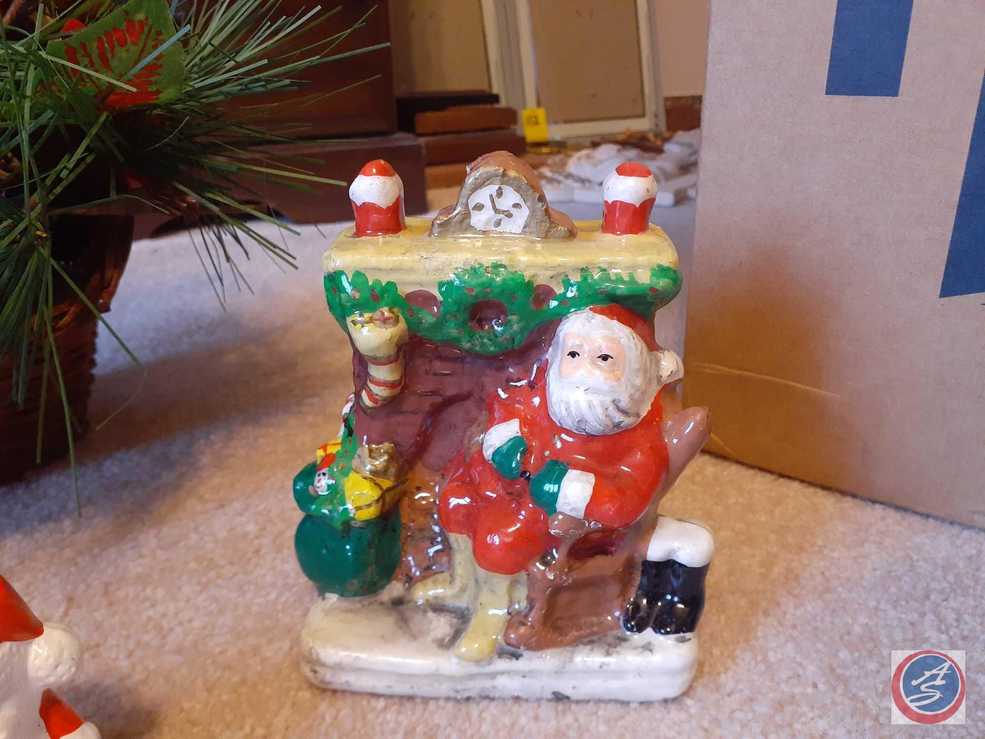 Assorted Holiday Decorations Including Santa's Sleigh, Small Nativity Scene, Santa and Mrs. Claus