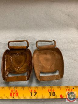 Two harness buckles appear to be copper