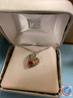 JCPenney heart necklace and a wells Scorpio necklace