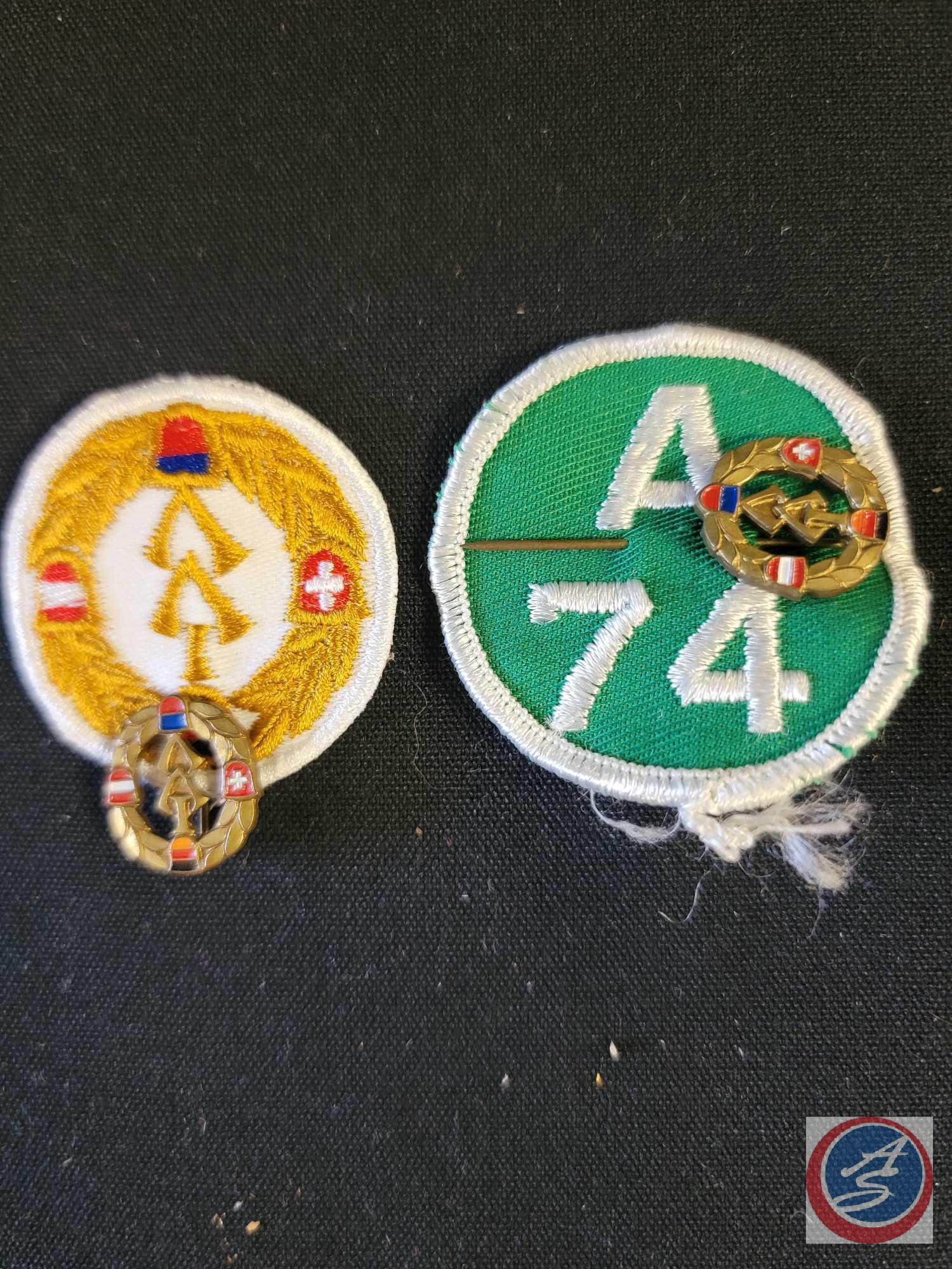 (1) Flat of assorted Patches and Pins, (1) Medal