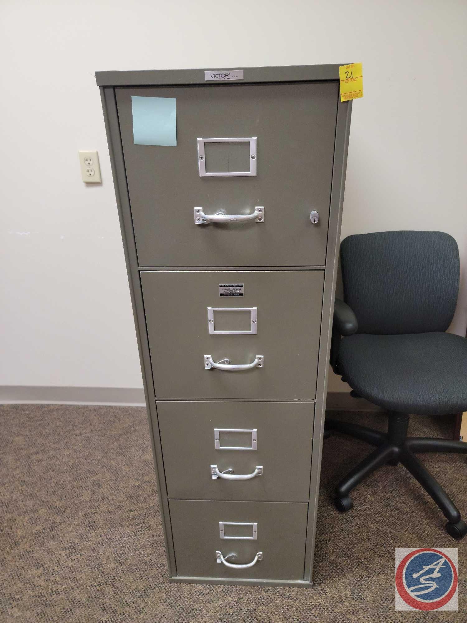 (2) 4 drawer metal file cabinets, 4 stacks of large binders, 2 cork boards, 3 HP printers and cloth