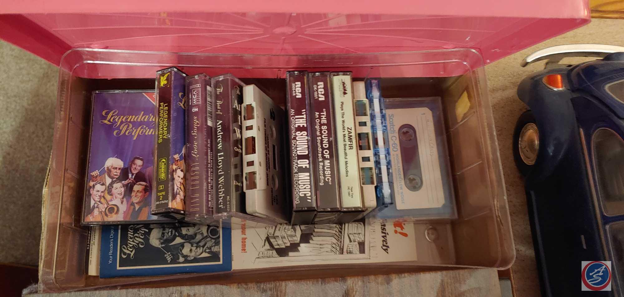 Variety of cassette tapes, older model cars and vase...