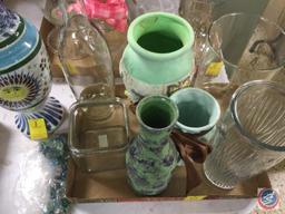 Assortment of clear glass and colored ceramic vases. Also included is a flower frog and flower frog