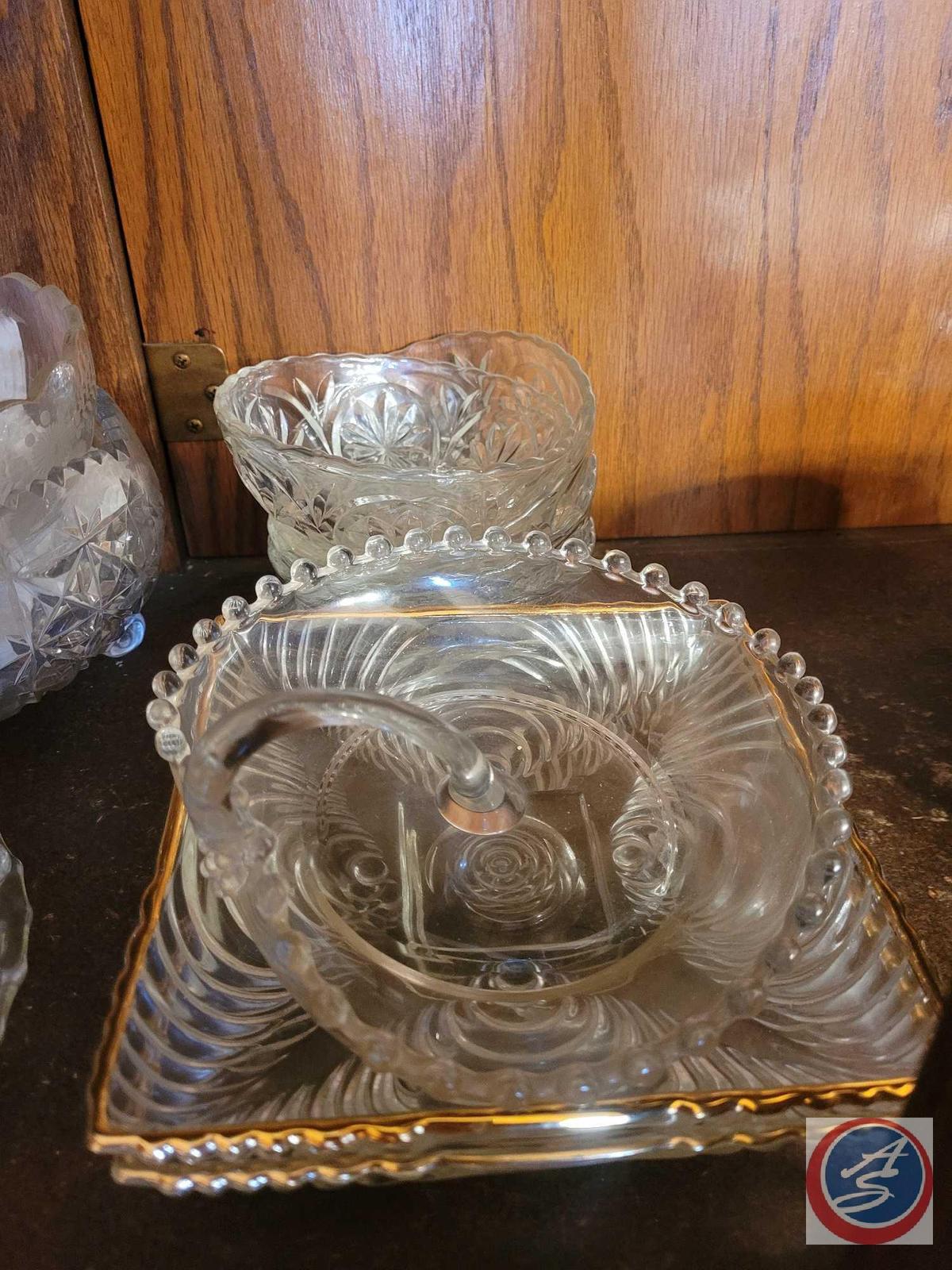 Assorted sizes of glass dishes, Unsure if any dishes are crystal. There are serving trays, candy