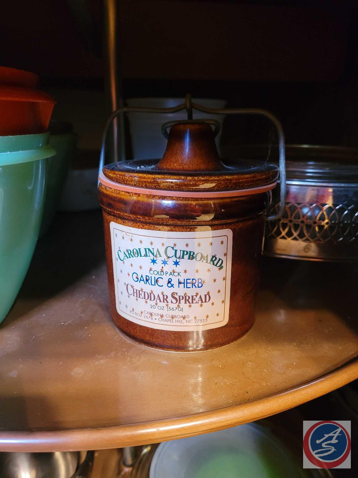 Assortment of kitchen tools. Including vintage promotional Pyrex dish, vintage Corningware saucepan,