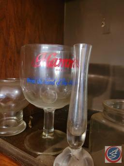 Assortment of beer advertisement glasses, brands include Schlitz, Falstaff, and Hamms. Also included