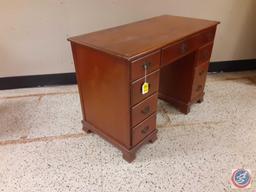 Wood Desk with 9 drawers approx measurements are; 43 x 21 1/2 x 30.