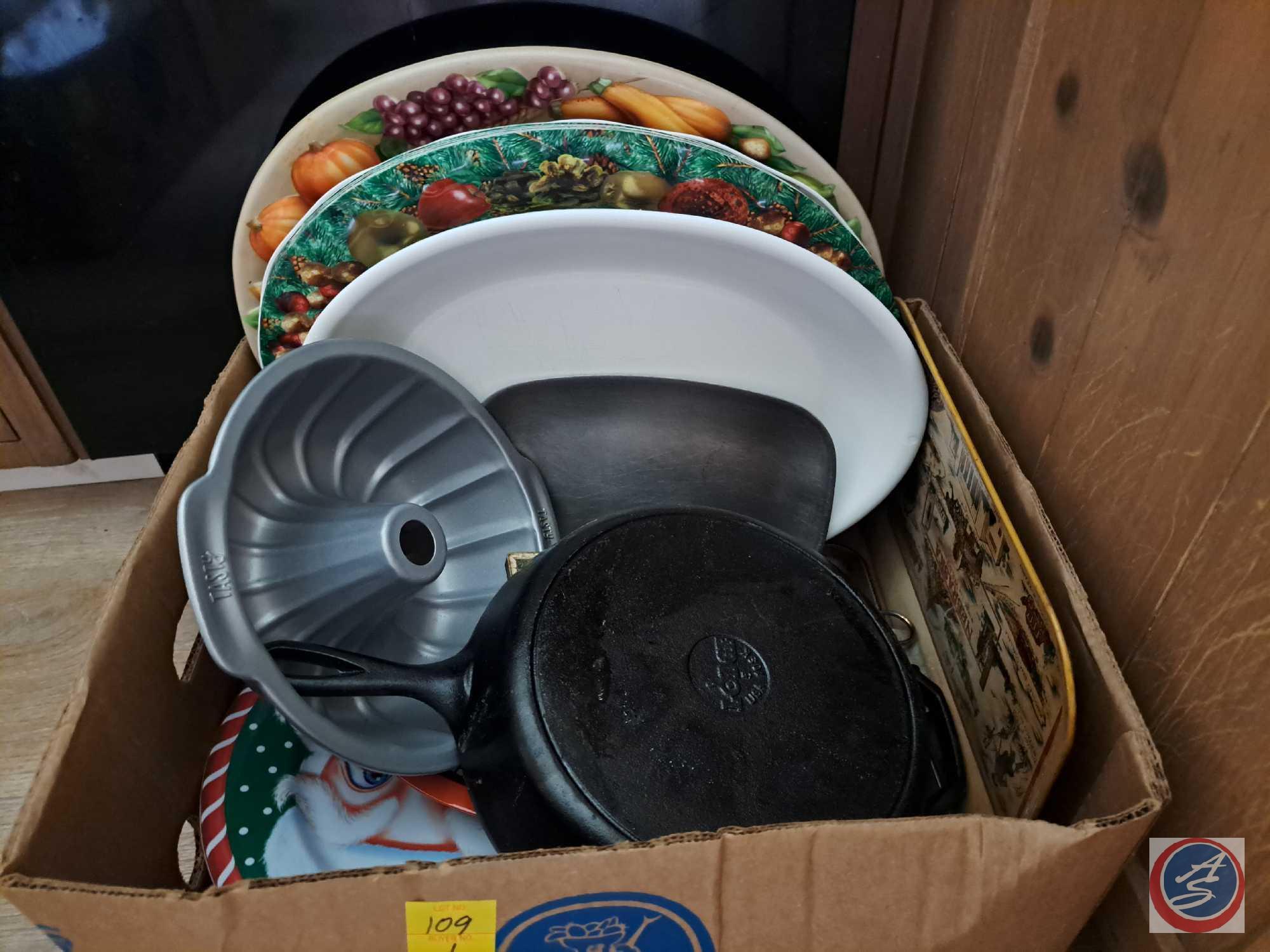 Temp-tations Presentable ovenware baking dishes, Box containing Cast iron skillet, bundt cake pan,