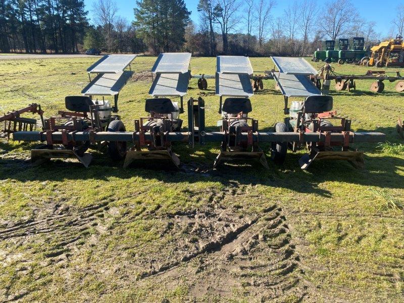 Holland 4 row tobacco setter with plant slides & row shapers