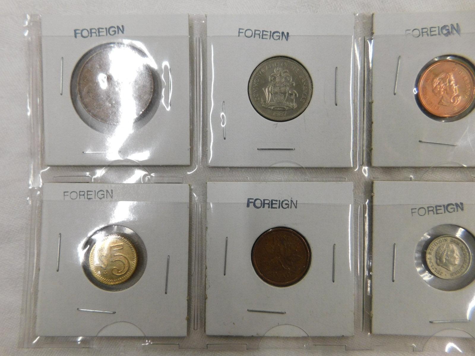 8 FOREIGN COINS