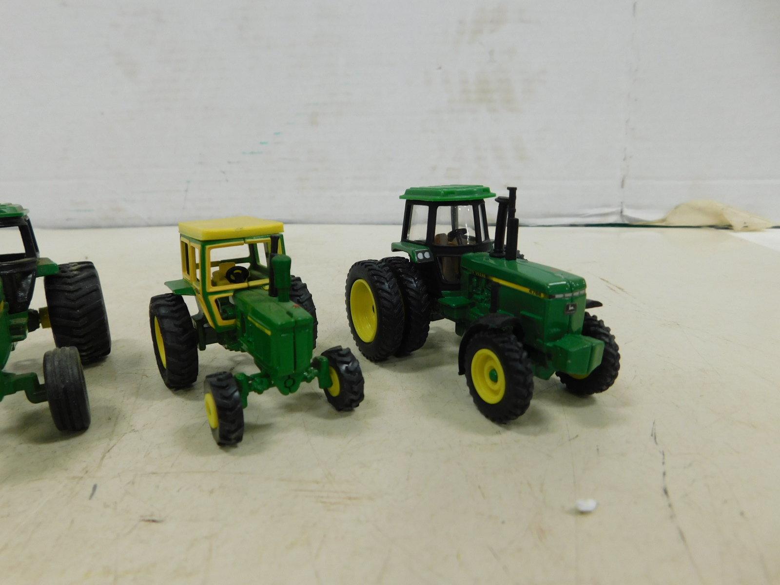 GROUP OF ERTL 1/64 JOHN DEERE TRACTORS