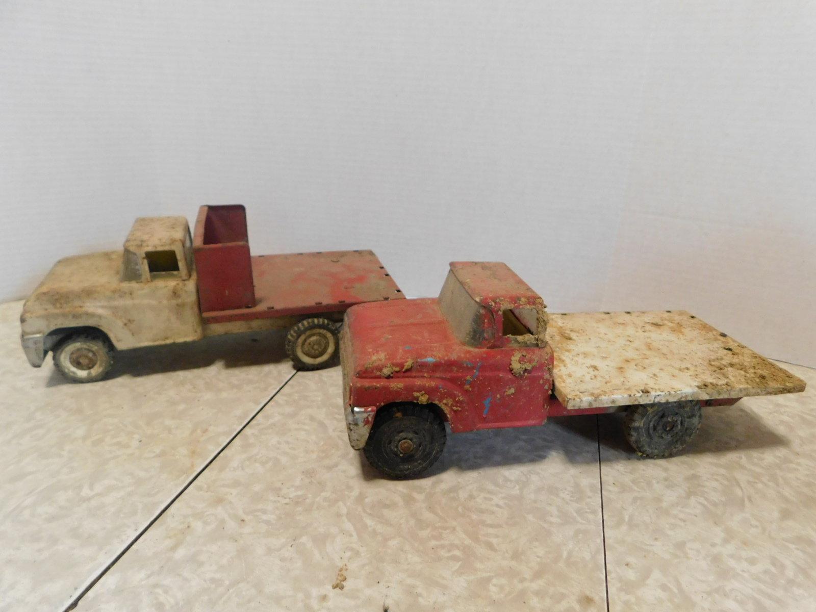 PAIR OF BUDDY L FLATBED TRUCKS