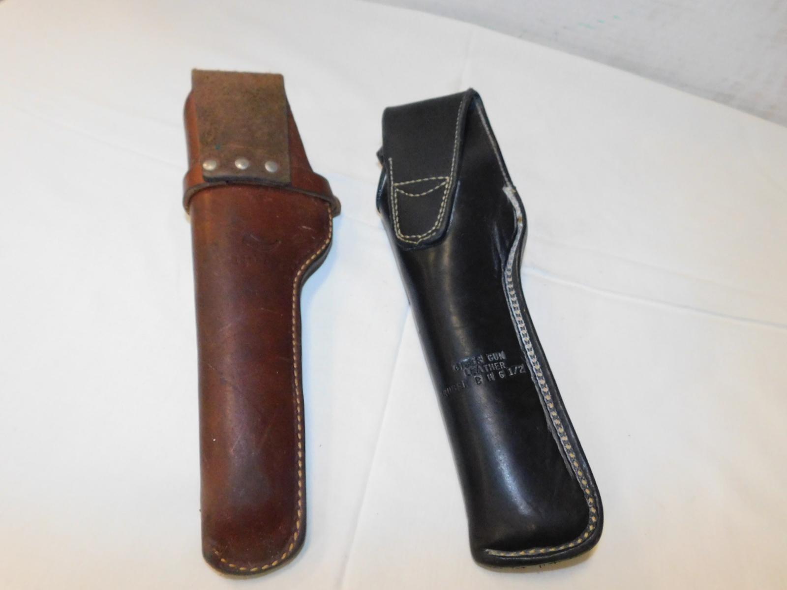 (2) LEATHER PISTOL HOLSTERS