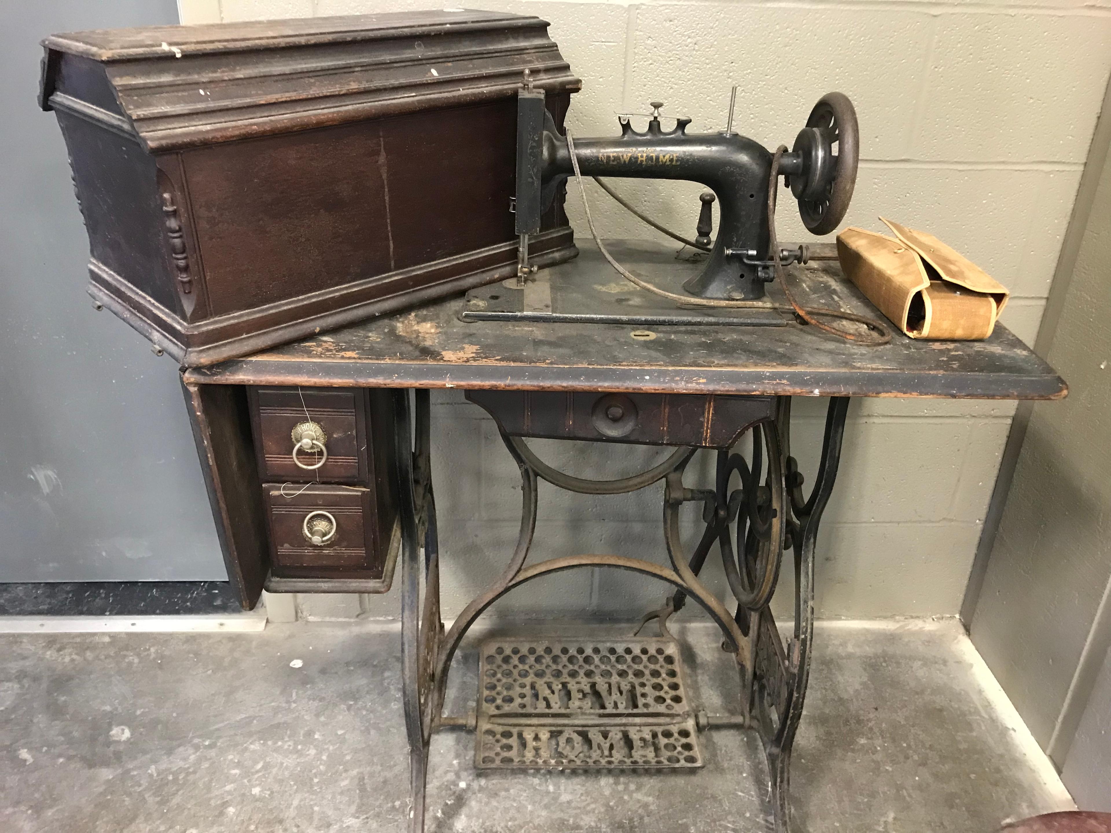 ANTIQUE NEW HOME TREADLE SEWING MACHINE W/ ATTACHMENTS