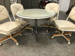 CHROME TABLE W/4 ROLL AROUND PADDED CHAIRS
