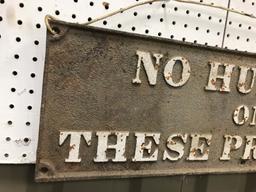 CAST IRON "NO HUNTING ON THESE PREMISES" SIGN