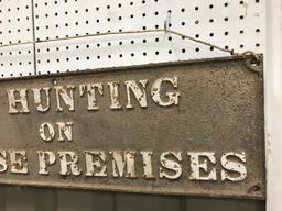 CAST IRON "NO HUNTING ON THESE PREMISES" SIGN