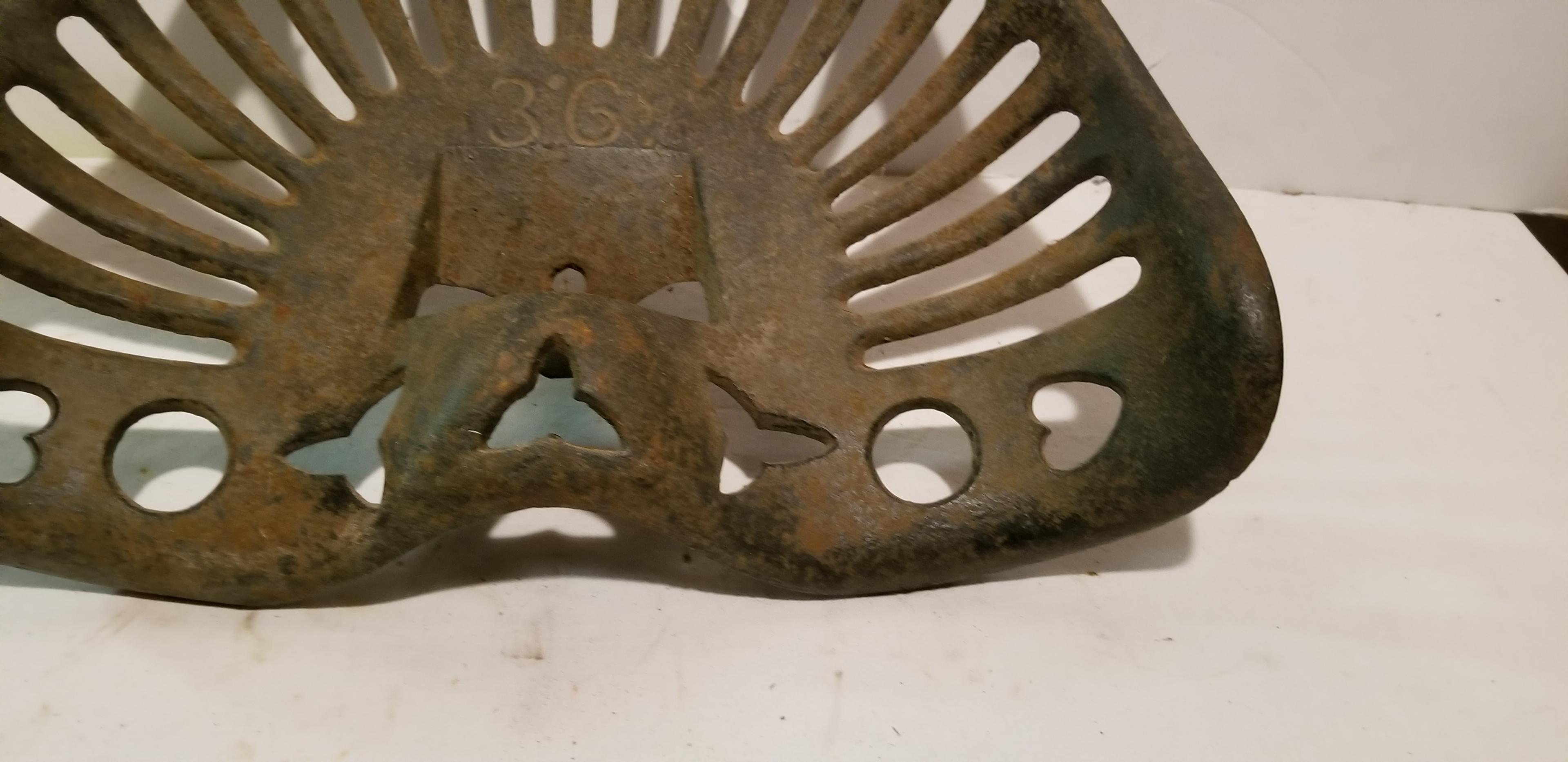 UNMARKED CAST IRON IMPLEMENT SEAT