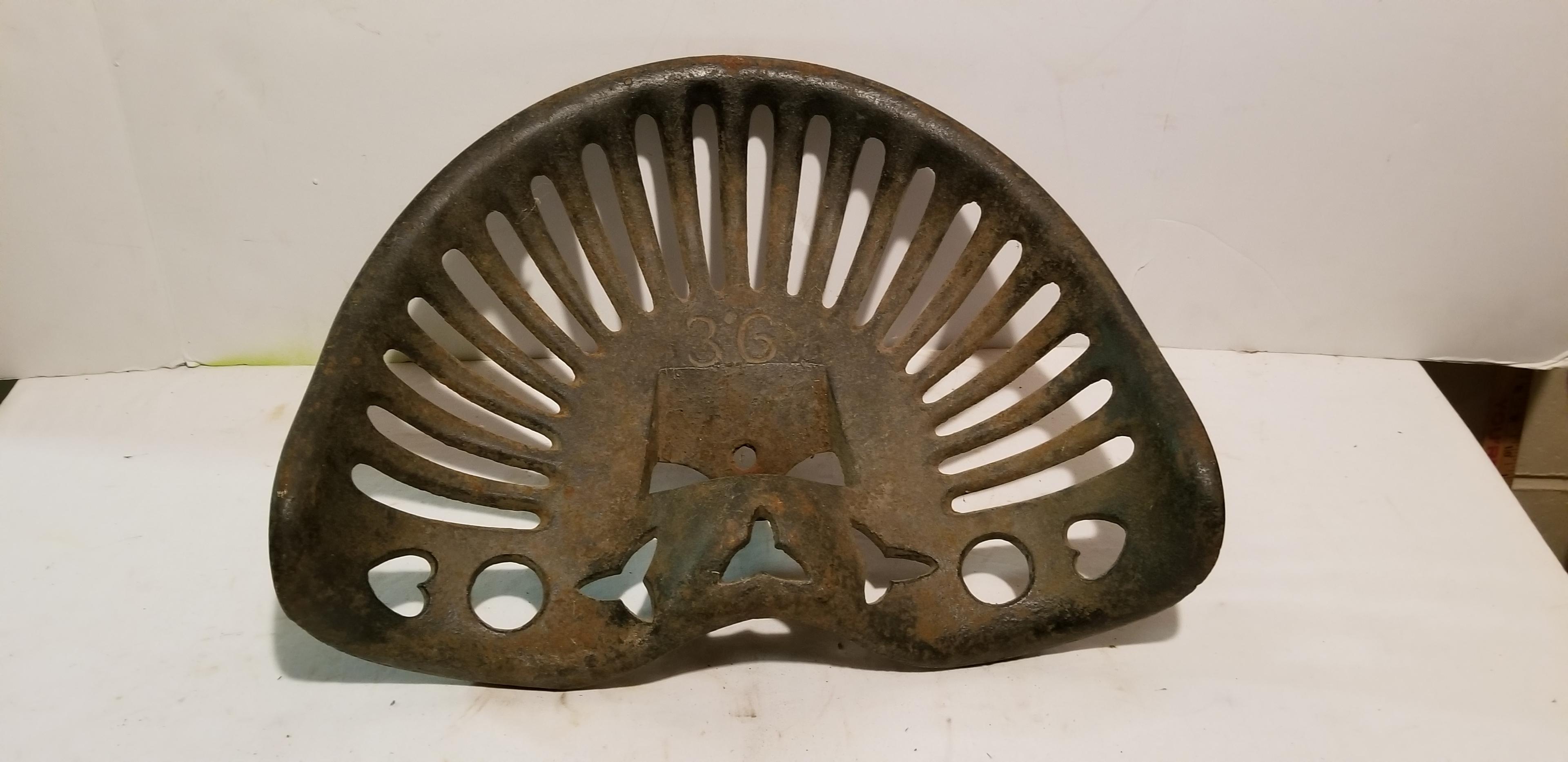 UNMARKED CAST IRON IMPLEMENT SEAT