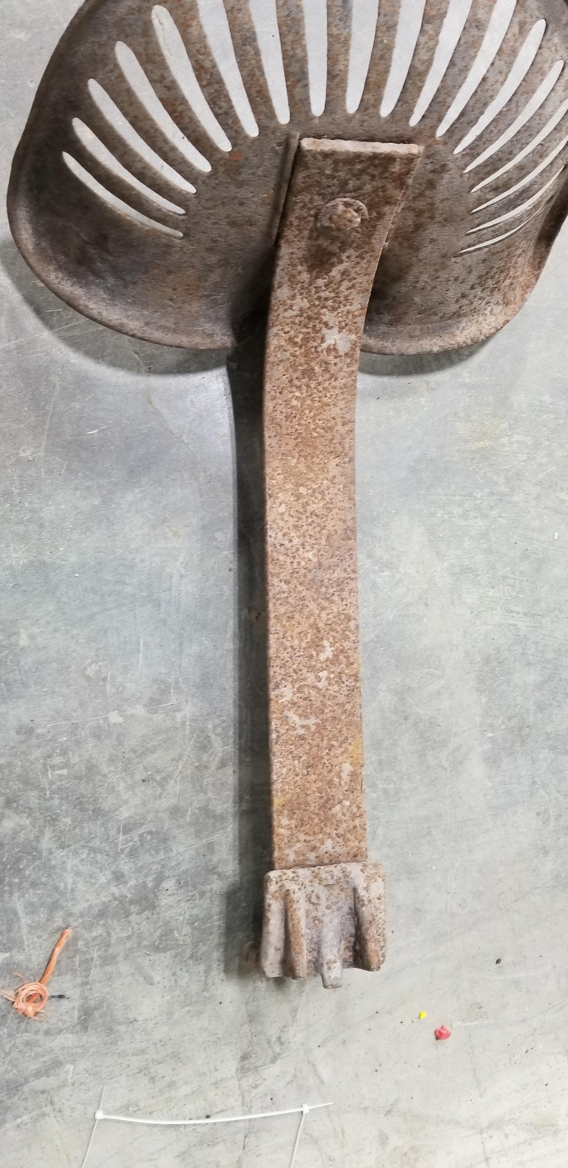 UNMARKED STEEL IMPLEMENT OR TRACTOR SEAT