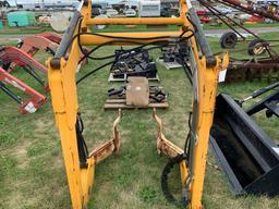 YELLOW HYDRAULIC LOADER FOR A COMPACT TRACTOR