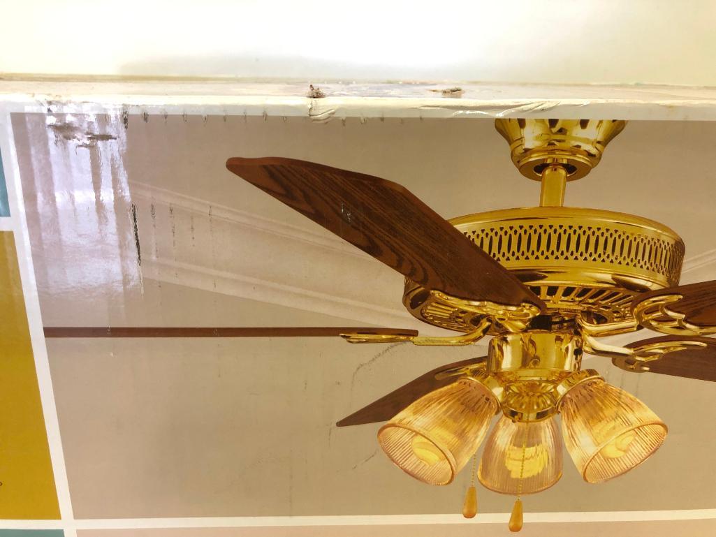 52 inch Hampton Bay Landmark Plus Ceiling Fan. Polished Brass Finish. Clear Ribbed Glass Shades.