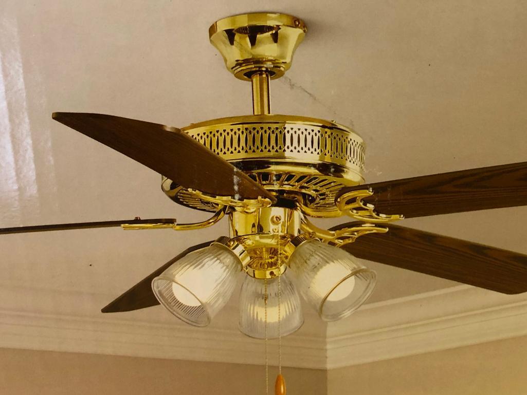 52 inch Hampton Bay Landmark Plus Ceiling Fan. Polished Brass Finish. Clear Ribbed Glass Shades.