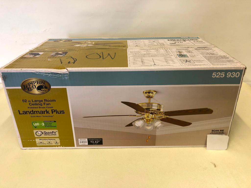 52 inch Hampton Bay Landmark Plus Ceiling Fan. Polished Brass Finish. Clear Ribbed Glass Shades.