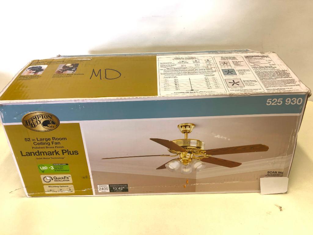 52 inch Hampton Bay Landmark Plus Ceiling Fan. Polished Brass Finish. Clear Ribbed Glass Shades.