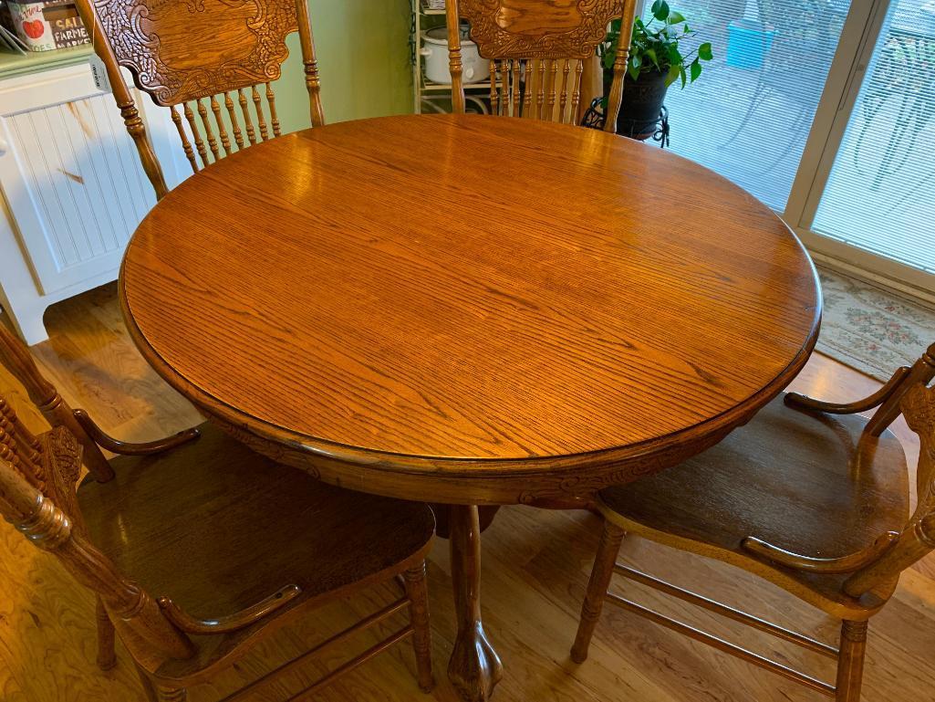 Round Oak Table W/(4) Matching Press-Back Spindle Chairs