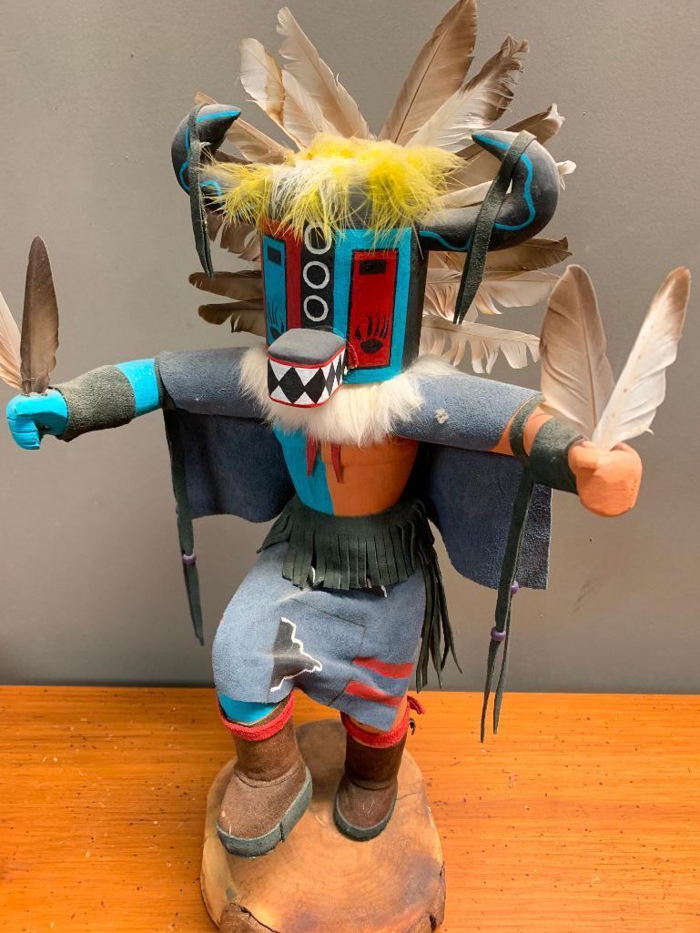 This is what appears to be a Road Runner Kachina Doll, Hand Crafted from Wood and Stands 23" Tall