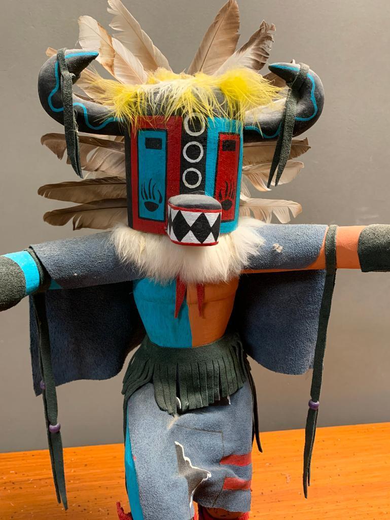 This is what appears to be a Road Runner Kachina Doll, Hand Crafted from Wood and Stands 23" Tall