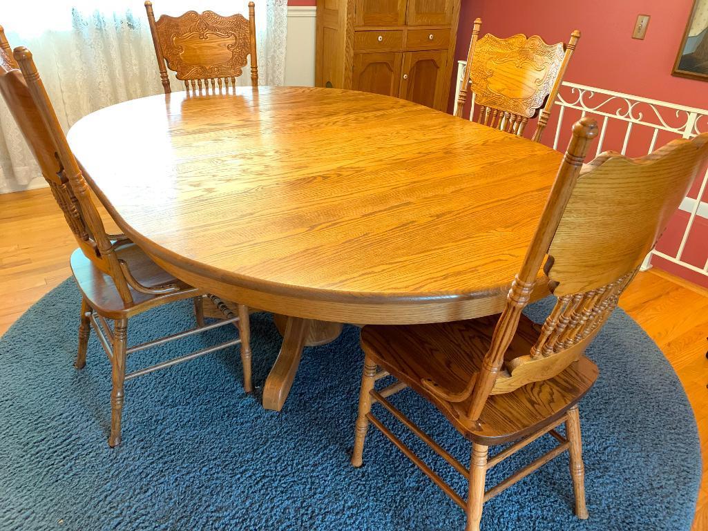 Round Oak Dining Table w/Leaf & 4 Press Back Chairs. This is 29" Tall x 53.5" Long x 54" Wide - As