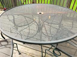 Wrought Iron Patio Set w/Table and 4 Chairs. This is 28" Tall x 48" in Diameter.- As Pictured