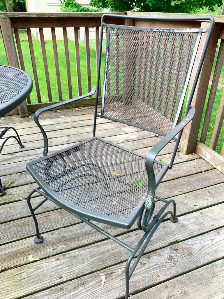 Wrought Iron Patio Set w/Table and 4 Chairs. This is 28" Tall x 48" in Diameter.- As Pictured