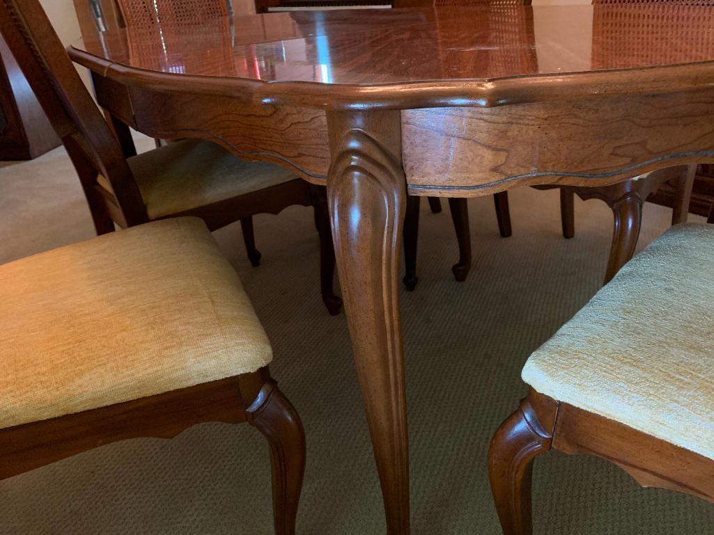 Solid Wood Dining Table w/6 Cane Back Chairs. The Table is 29" Tall x 70" Long x 42" Wide