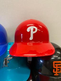 9 National League Baseball Helmets. They are 5.5" Tall - As Pictured