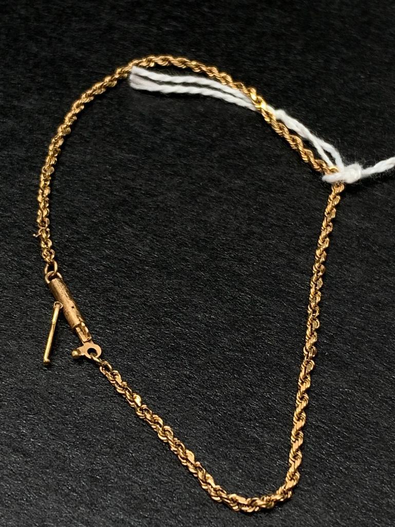 10 KT Gold 7" Bracelet w/Safety Lock. The Weight is 2.1 Grams - As Pictured