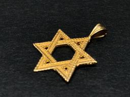 14 KT Gold Jewish Star Charm. The Weight is 1.4 Grams - As Pictured
