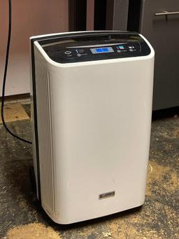 Kenmore Dehumidifier. This is 25" T x 15" W x 12" D & is in Working Condition - As Pictured