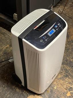 Kenmore Dehumidifier. This is 25" T x 15" W x 12" D & is in Working Condition - As Pictured