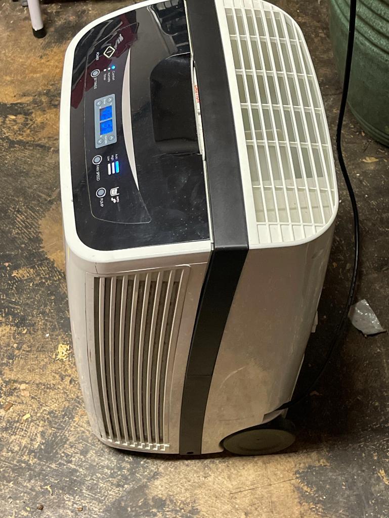 Kenmore Dehumidifier. This is 25" T x 15" W x 12" D & is in Working Condition - As Pictured