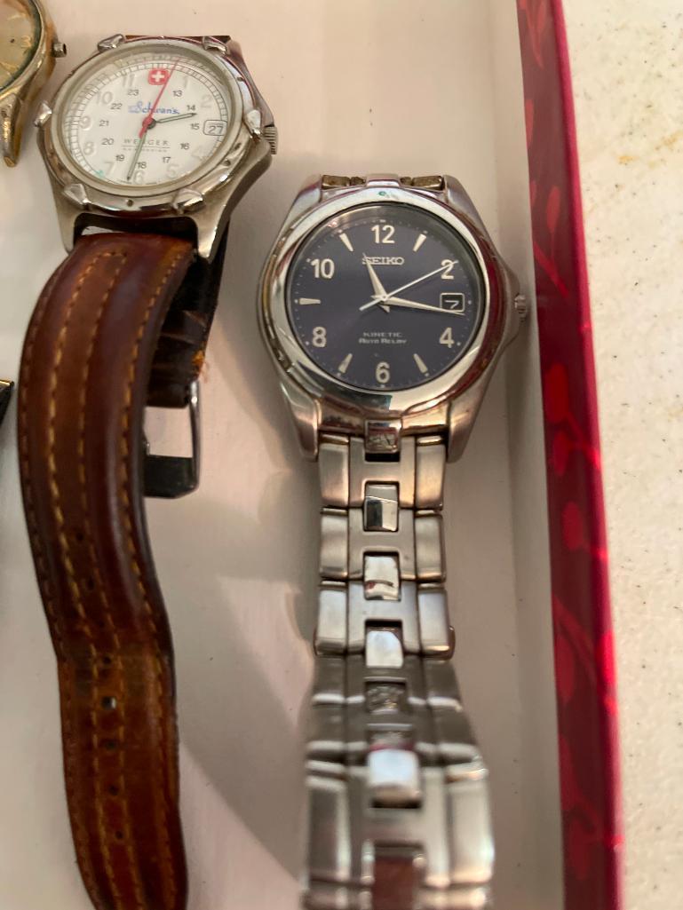 Lot of 6 Men's Wristwatches. One has Band Missing. - As Pictured