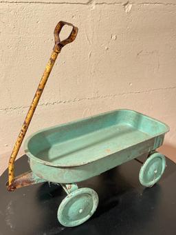 Antique Little toy Blue Metal Wagon. Has Rust Condition Issues. This is 6.5" x 15" - As Pictured